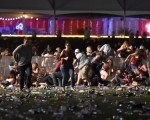 LAS VEGAS, NV - OCTOBER 01 People run from the Route 91 Harvest country music festival after apparent gun fire was heard on October 1, 2017 in Las Vegas, Nevada. There are reports of an active shooter around the Mandalay Bay Resort and Casino.   David Becker/Getty Images/AFP